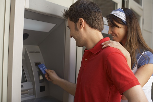 couple-using-atm-machine