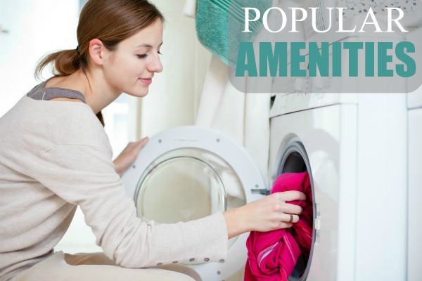 Housework: young woman doing laundry (shallow DOF; color toned image)