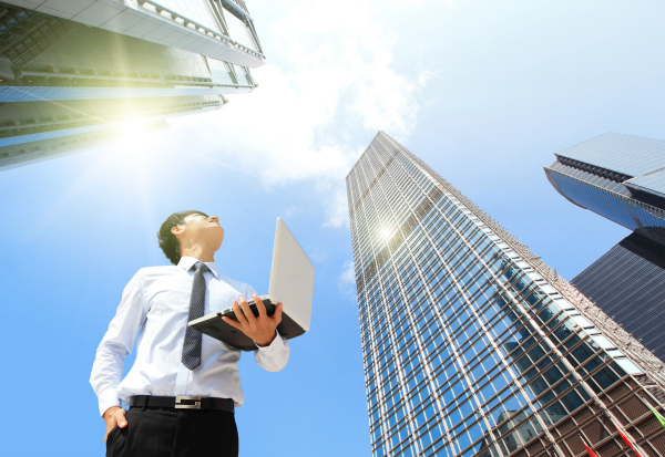 Businessman looking at sky - ForRent.com