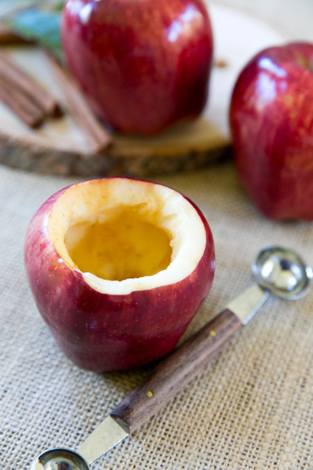 Cozy up this fall with a cup of easy homemade citrus apple cider in an edible apple cup and cinnamon drink stirrer!