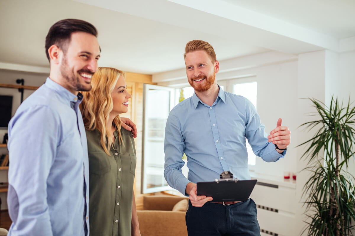 Landlord and renters discuss a lease.