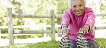 Senior woman exercising, a favorite among senior living activities.