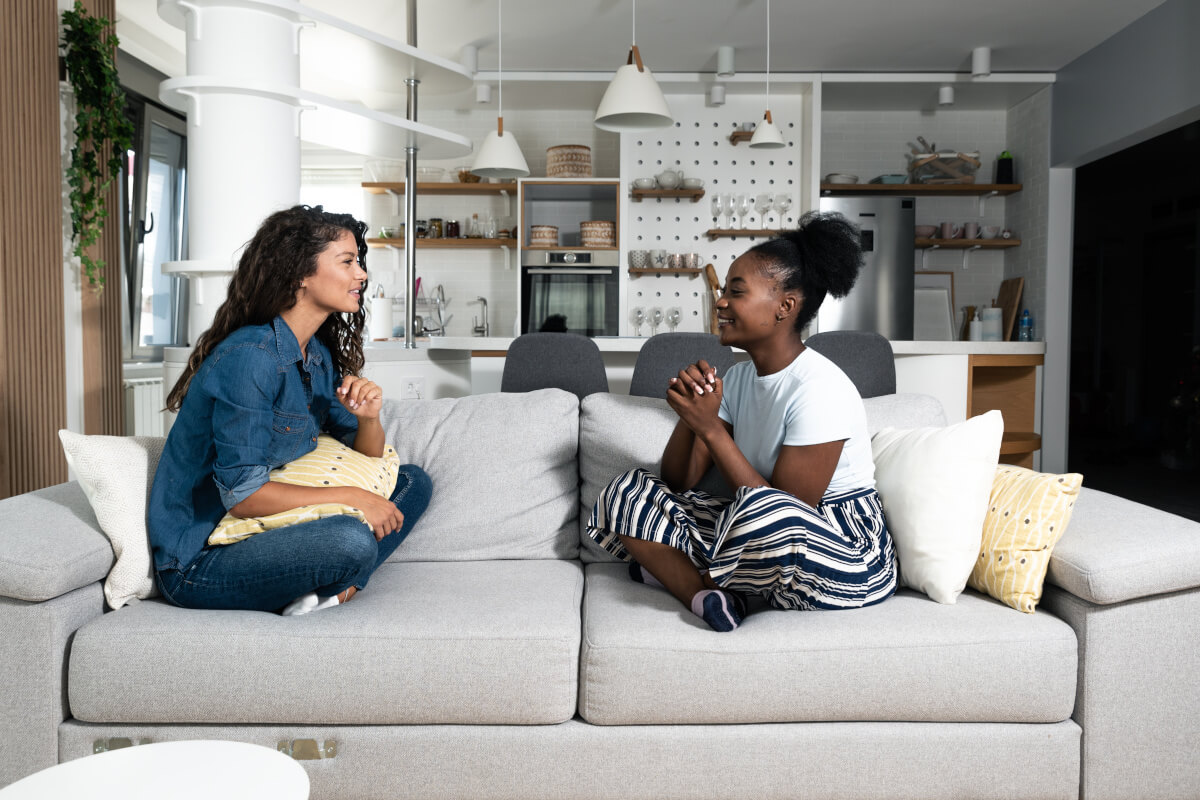 Roommates hanging out on the couch