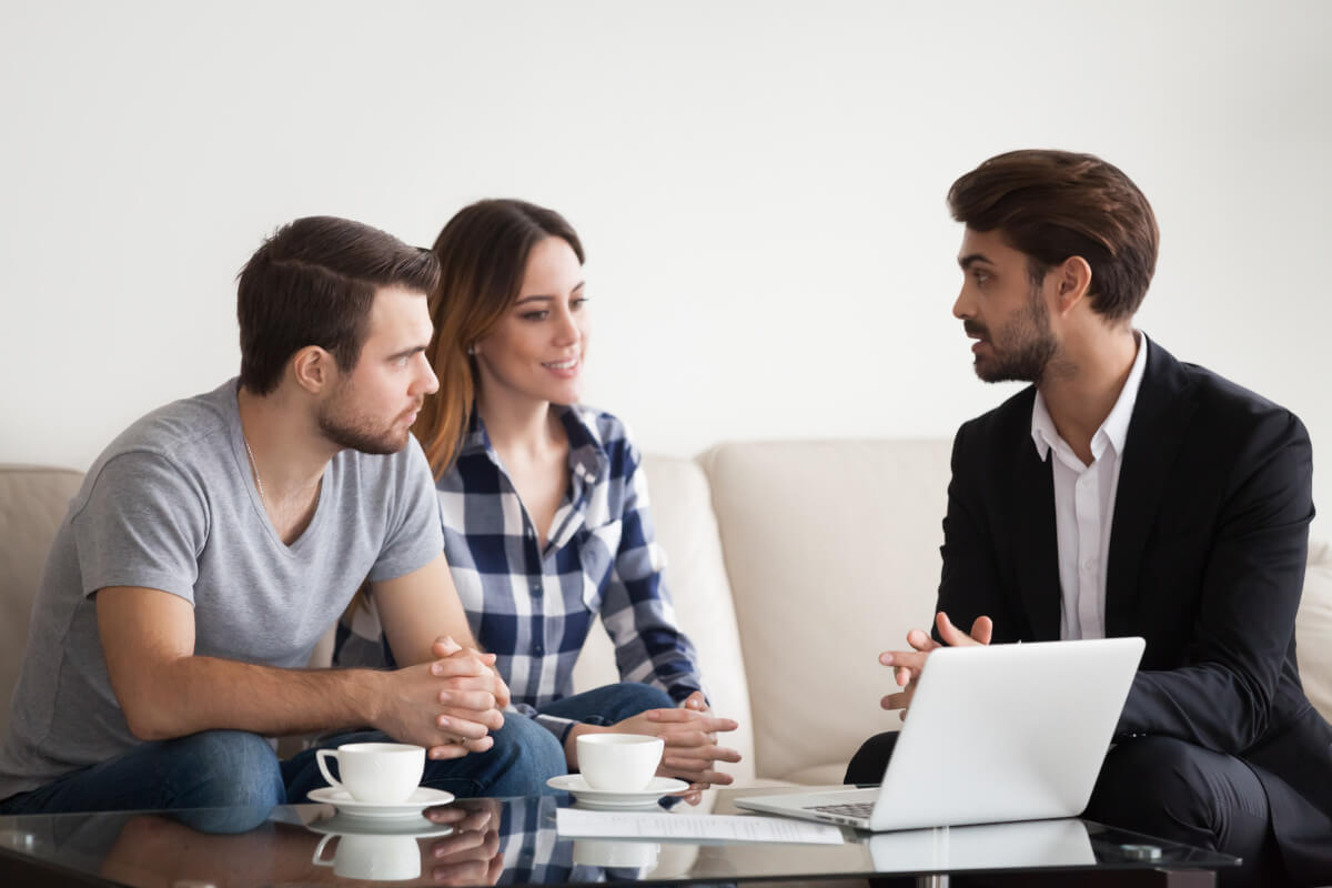 Renters discuss smart home device options with their landlord.